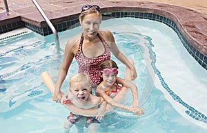 Family playing in the Swimming Pool