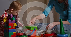 Family Playing Together Mother and Child with Toys and Building Blocks