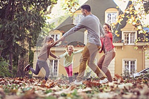 Family playing together outside. On the move.