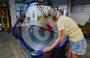 Family plays air hockey