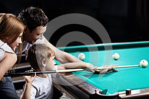 The family plays billiards photo