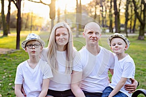 Family portrait on bench in park