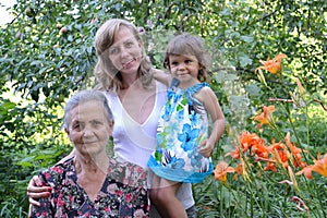 Family portrait in a garden, three generations