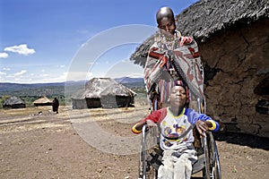 Family portrait of Maasai mother and disabled son