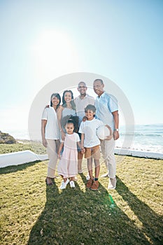 Family, portrait and outdoors with happiness in nature with ball in mockup space with children. Happy, parents and