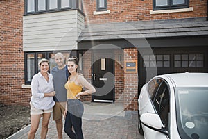 Family Portrait Outside of New Home