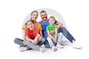 Family portrait. parents and children in colorful T-shirts on an isolated white background