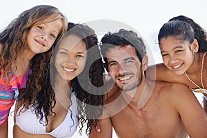 Family in portrait, parents and kids on beach, happy together on tropical summer vacation for bonding and love. Man