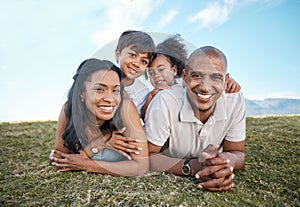 Family, portrait and relax parents in garden with mother, father and kids together with love. Face, top view and dad