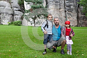 Family portrait beside rocks