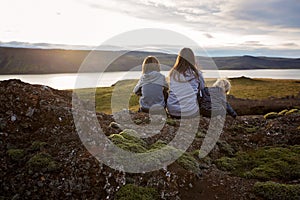 Family posing in Geothermal area in Reykjanesfolkvangur, enjoying the view of a splendid nature in Iceland