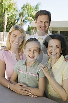 Family Posing Together on Backyard Patio