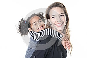 A family posing on a white background studio