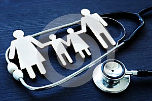 Family practices. Figures and stethoscope. Health care. photo