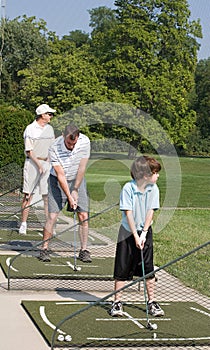 Family Practicing Golf