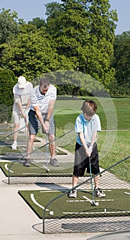 Family Practicing Golf