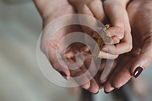 Family prayer with wooden rosary