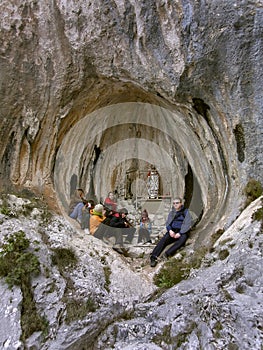Family in prayerful meditation in a hole