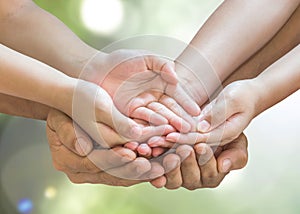 Family praying together  with clipping path for donation for the poor, CSR  charity concept with kid and parent`s hands