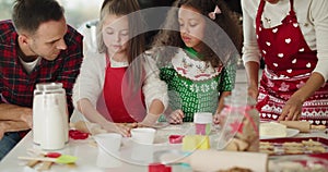 Family preparing christmas cookies in the kitchen