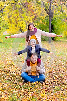 Family pretend plane autumn park