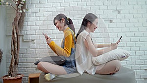 Family problems of internet addiction concept , mother and teen daughter with smartphones networking