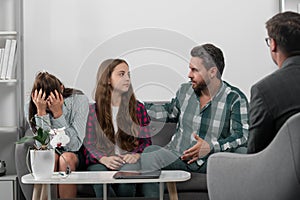 Family at psychology session. Psychologist with young couple, psychotherapist or marriage counselor listen mental health