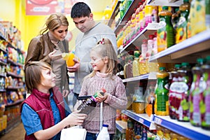 Family purchasing carbonated beverages