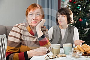 Family quarrel of an elderly mother and adult daughter