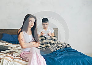 Family quarrel. The guy and the girl have strongly quarreled. The guy has a dependence on the smartphone