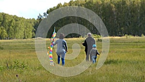 Family with rainbow kite outdoor