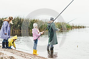 family in raincoats and boots