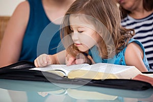 Family Reading the Bible Together