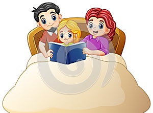 Family reading a book to daughter on bed on a white background