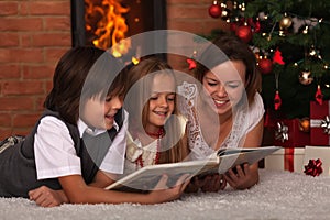 Family reading stories at Christmas time