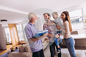 Family with real-estate agent visiting house for sale