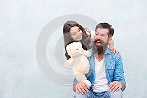 Family relations. Fathers day concept. Giving soft toy teddy bear. Lovely father and kid. Father and daughter light