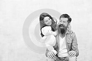 Family relations. Fathers day concept. Giving soft toy teddy bear. Lovely father and kid. Father and daughter light