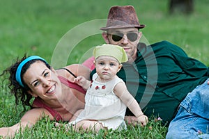 Family relaxes in a meadow
