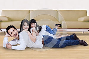 Family relaxing on the floor at home