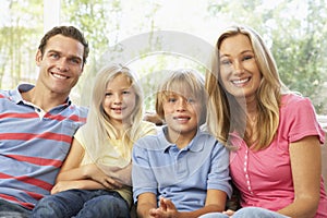 Family Relaxing At Home Together