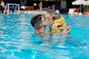 Family rest in pool