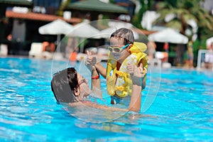 Family rest in pool