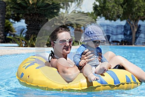 Family resting on swim ring