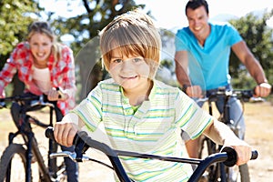 Family riding bikes having fun