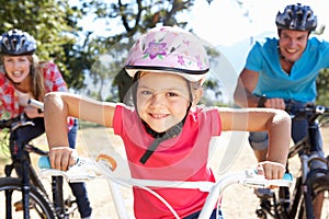 Family riding bikes having fun