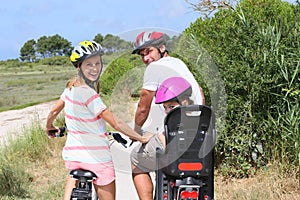 Family riding bikes and sightseeing