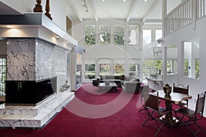 Family room with two story windows