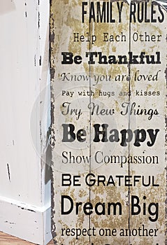 Family rules print on wooden wall background