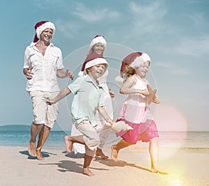 Family Running Beach Christmas Holiday Vacation Concept